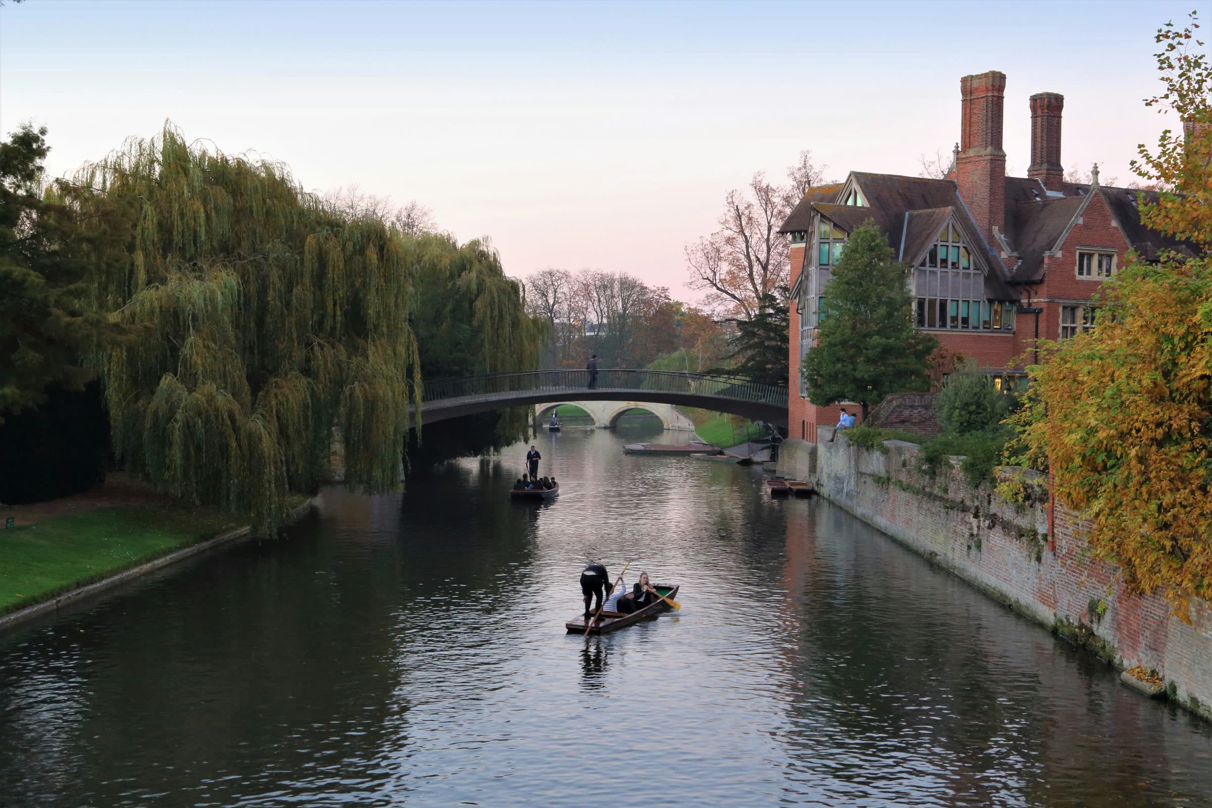 Punts on the River Cam passing the college Backs in Cambridge