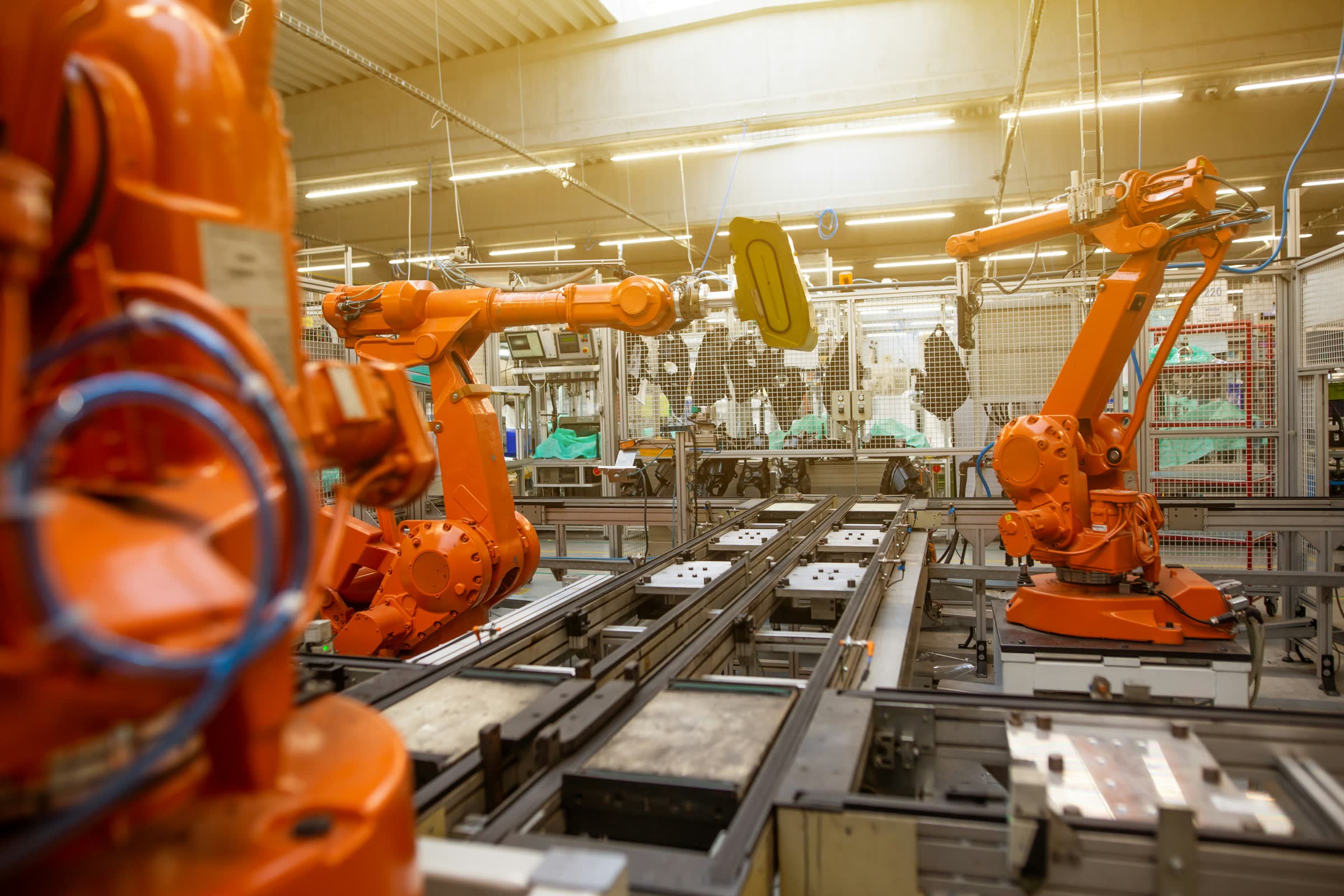 Robotic welding arms on an automated production line